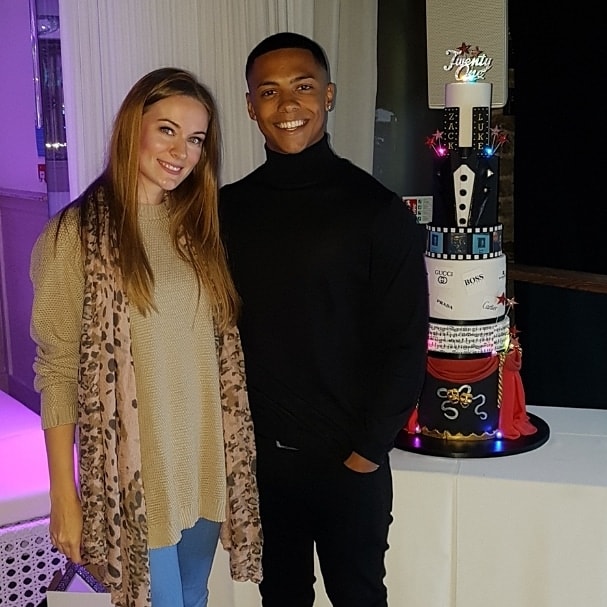 Leigh with Zack Morris next to his 21st birthday cake