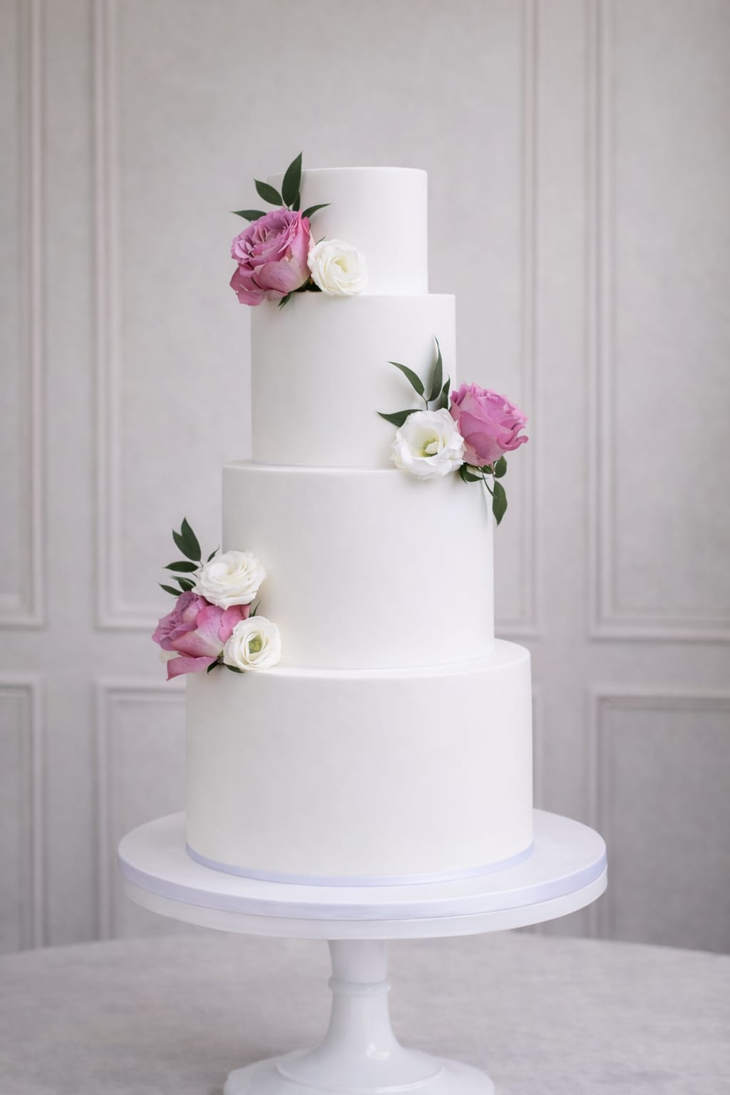 Four tier clean white wedding cake, Essex